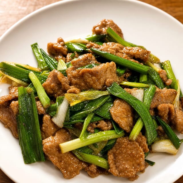 E4. 葱爆牛肉 Fire Wok Scallion Beef.